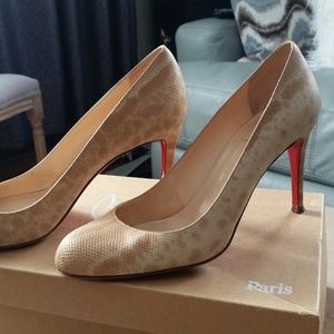 Christian Louboutin snake skin shoe